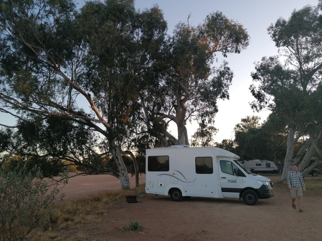 Autocamper under trees in the wild 