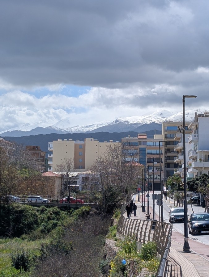Snowcapped mountains seen from Chania seaside, Crete