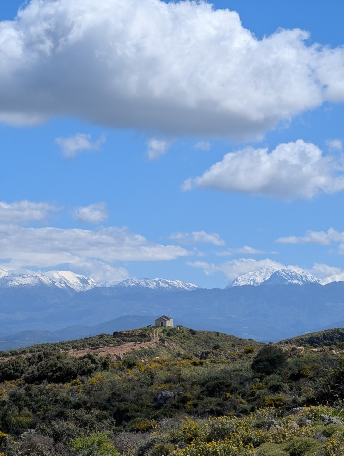 A small cabin on a hill against snow-capped mountains afar, Kolymbari - Western Crete
